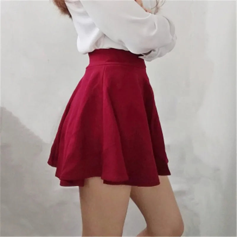 Jupe femme style été 2026 jupe de couleur unie sexy taille haute midi plissée jupes à rayures noires style école coréen mini trapèze jupe